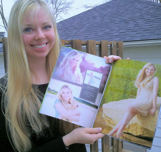 Kellsey holding up a copy of her editorial for international magazine - Petite Magazine